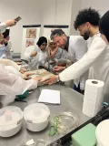 During the workshop on gluing and grouting, Jakub Ďoubal, head of the Studio of Restoration of Sculpture in Stone and Related Materials, demonstrates the preparation of a broken mosaic panel.